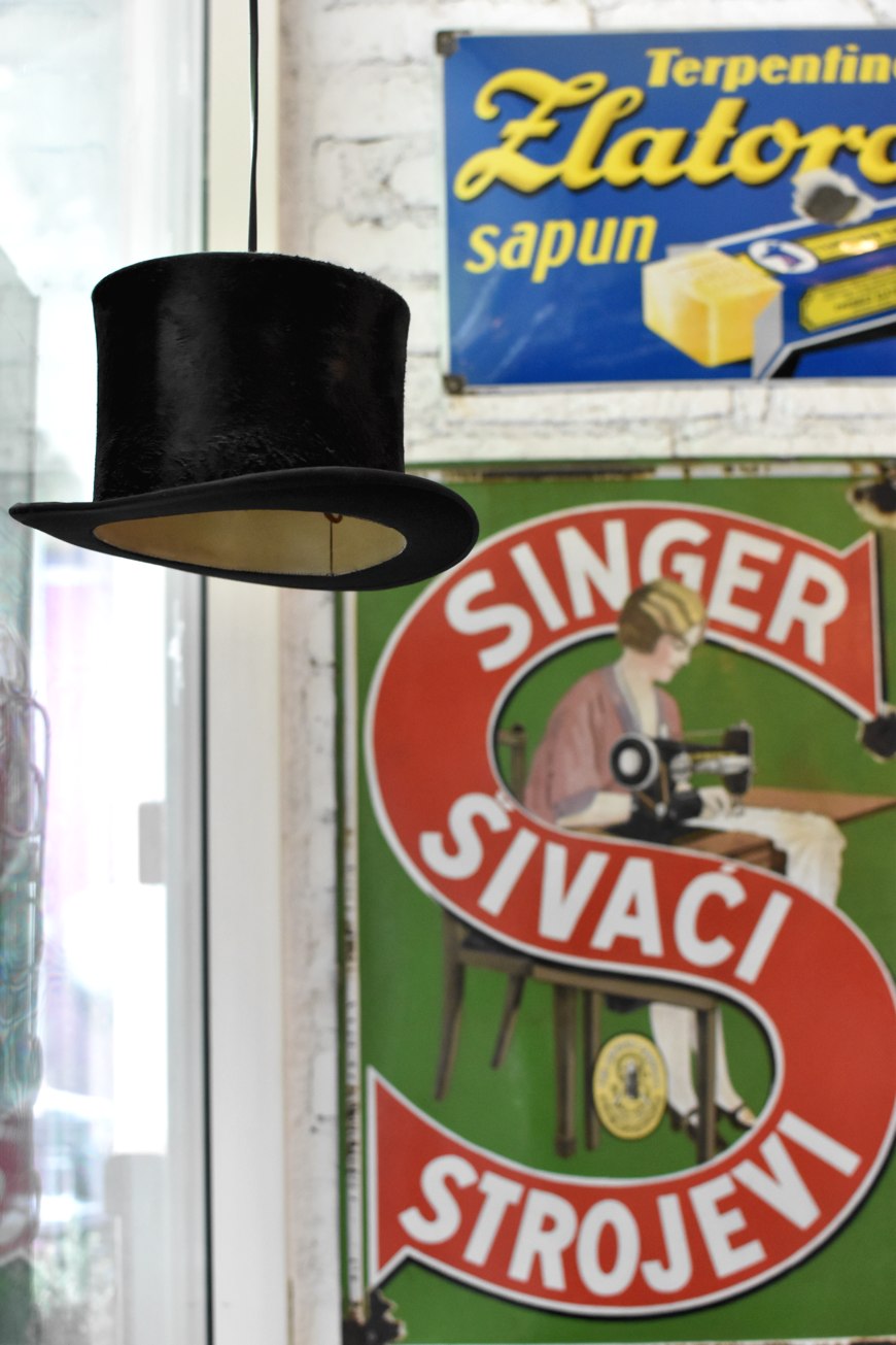 Finjak cafe in Zagreb, retro ads and hat turned into lamps
